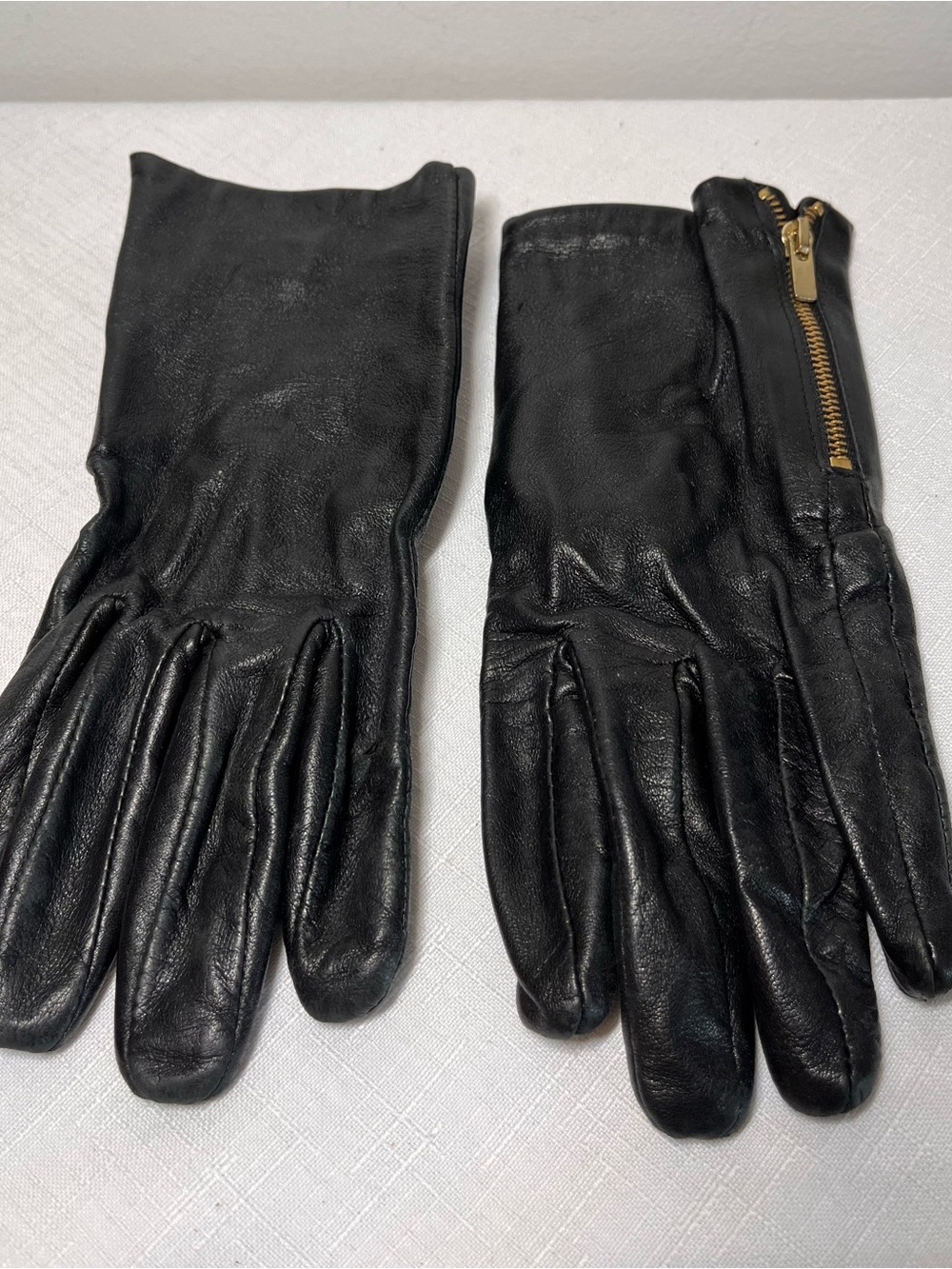Black Leather Gloves with Gold Zipper Accent. Dillards
XL. 7.5-8